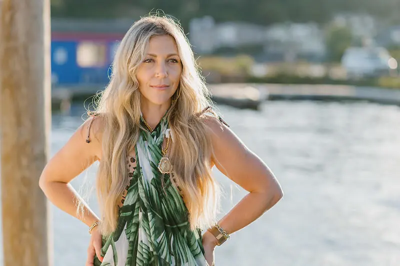 Guest with long blonde hair on the water