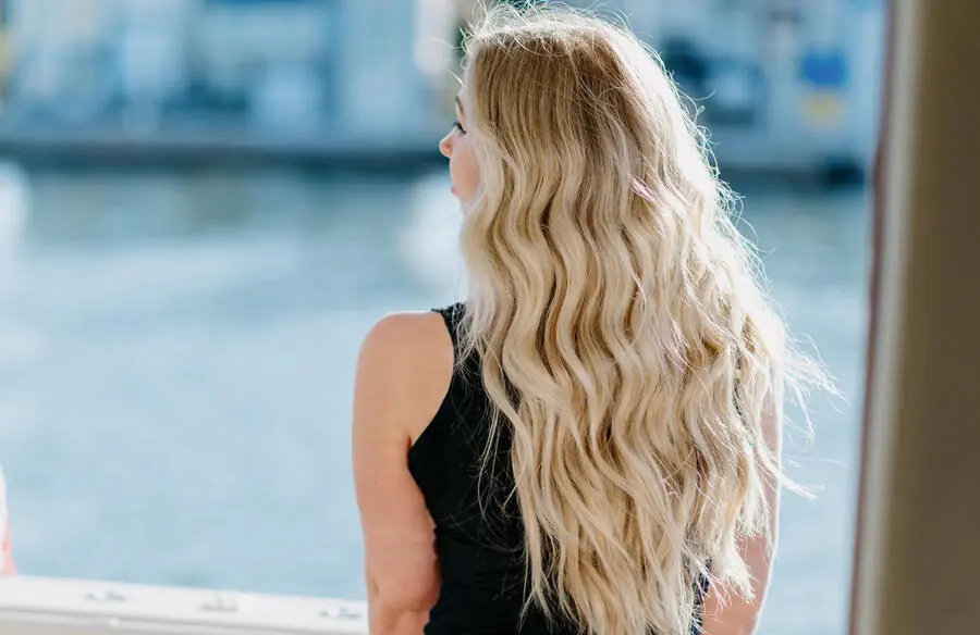 Long blonde waves by the water